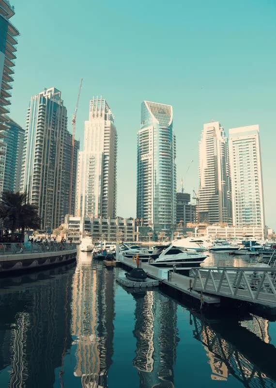 Charter yachts of different sizes berthed in Dubai Marina